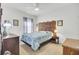 Inviting bedroom with patterned bedding, ornate headboard, and neutral decor for a relaxing atmosphere at 222 Hayworth Rd, Summerville, SC 29486