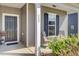 Charming front porch features comfortable seating, elegant details, and lush landscaping at 222 Hayworth Rd, Summerville, SC 29486