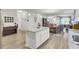 Open-concept kitchen features a central island, stainless steel appliances, and seamlessly connects to the dining and living areas at 222 Hayworth Rd, Summerville, SC 29486