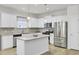 Modern kitchen with white cabinets, granite countertops, stainless steel appliances, and center island at 222 Hayworth Rd, Summerville, SC 29486