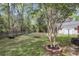 Picturesque backyard featuring a storage shed and mature landscaping at 227 Lipman St, Summerville, SC 29483
