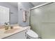 Bathroom boasts a shower with sliding glass doors, stylish fixtures, and neutral colors at 227 Lipman St, Summerville, SC 29483