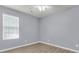 Bedroom featuring neutral walls, modern ceiling fan, and a window with views of the outside at 227 Lipman St, Summerville, SC 29483