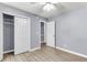 Bedroom features neutral walls, an open closet with shelving, and a modern ceiling fan at 227 Lipman St, Summerville, SC 29483