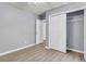 Bedroom featuring neutral walls, an open closet with shelving, and two doors at 227 Lipman St, Summerville, SC 29483