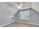 Bright bedroom featuring sloped ceilings, a ceiling fan, and a window offering plenty of natural light at 227 Lipman St, Summerville, SC 29483