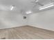 Spacious bonus room with laminate flooring, ceiling fans, and natural lighting from windows at 227 Lipman St, Summerville, SC 29483