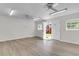 Bonus room with backyard access to the deck, laminate flooring, and multiple ceiling fans at 227 Lipman St, Summerville, SC 29483