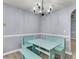 Charming breakfast nook with aqua seating, light fixture and great natural light at 227 Lipman St, Summerville, SC 29483