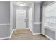 Clean foyer with a window, neutral paint, modern flooring, and closet for storage at 227 Lipman St, Summerville, SC 29483