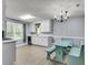 Eat-in kitchen with white cabinets, stainless steel appliances, and blue breakfast nook at 227 Lipman St, Summerville, SC 29483