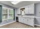 Bright kitchen featuring white cabinets, modern appliances, and a large window with natural light at 227 Lipman St, Summerville, SC 29483