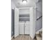 Convenient laundry closet with washer, dryer, and shelving for efficient storage at 227 Lipman St, Summerville, SC 29483