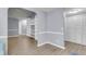 Neutral living room with wood floors, built-in bookcase and ample storage space at 227 Lipman St, Summerville, SC 29483