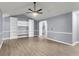 Open living room with ceiling fan, soft gray walls, and direct access to second story at 227 Lipman St, Summerville, SC 29483