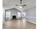 Inviting living room with cozy fireplace, large windows and wood-look flooring at 227 Lipman St, Summerville, SC 29483
