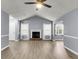 Bright living room featuring a fireplace, stylish flooring, and plenty of natural light at 227 Lipman St, Summerville, SC 29483