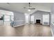Comfortable living room featuring fireplace, wood-look floors and open access to kitchen at 227 Lipman St, Summerville, SC 29483