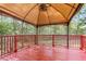 A covered patio in the backyard with a seating area at 227 Lipman St, Summerville, SC 29483