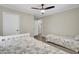 Bedroom featuring twin beds, ceiling fan, and neutral decor for a comfortable space at 237 Cypress Dr, Walterboro, SC 29488
