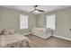 Bedroom featuring twin beds, ceiling fan, and neutral decor for a comfortable space at 237 Cypress Dr, Walterboro, SC 29488