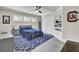 Bedroom with built in shelves, blue rug, and ceiling fan at 237 Cypress Dr, Walterboro, SC 29488