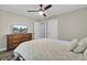 Bedroom with light walls, ceiling fan, and dresser featuring a television at 237 Cypress Dr, Walterboro, SC 29488