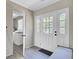 Entryway with a white door and sidelights leading to the laundry room at 237 Cypress Dr, Walterboro, SC 29488