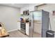 Kitchen featuring stainless steel appliances, wood countertops, and white cabinets at 237 Cypress Dr, Walterboro, SC 29488