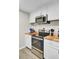 White kitchen cabinets and stainless steel oven and microwave with butcher block countertops at 237 Cypress Dr, Walterboro, SC 29488