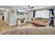 Spacious living room featuring a decorative fireplace, comfortable seating, and hardwood floors at 237 Cypress Dr, Walterboro, SC 29488