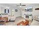 Open-concept living room with hardwood floors, natural light, and a view into the kitchen at 237 Cypress Dr, Walterboro, SC 29488