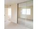 Bedroom featuring mirrored closet doors and entry way to other rooms at 2402 Riverridge Ct, Moncks Corner, SC 29461