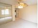 Bedroom featuring mirrored closet doors, carpet, and access to an adjacent room at 2402 Riverridge Ct, Moncks Corner, SC 29461
