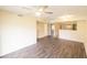 Large living room with modern wood-look floors, neutral walls, and recessed lighting at 2402 Riverridge Ct, Moncks Corner, SC 29461
