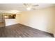 Spacious living room featuring wood-look floors, a ceiling fan, and neutral walls at 2402 Riverridge Ct, Moncks Corner, SC 29461