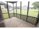 Enclosed patio with lattice decoration overlooking green spaces at 2402 Riverridge Ct, Moncks Corner, SC 29461