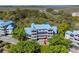 Aerial view of complex with blue metal roofs surrounded by trees at 2413 Racquet Club Dr, Seabrook Island, SC 29455