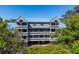 An aerial view of the condo complex and surrounding trees at 2413 Racquet Club Dr, Seabrook Island, SC 29455