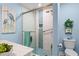 Stylish bathroom with a glass-enclosed shower, blue accents, and coastal decor, creating a tranquil spa atmosphere at 2413 Racquet Club Dr, Seabrook Island, SC 29455