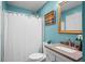 Bathroom features a granite vanity top and a shower with a white shower curtain at 2413 Racquet Club Dr, Seabrook Island, SC 29455