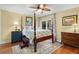 Comfortable bedroom with a four-poster bed, ceiling fan, and a sliding glass door leading outside at 2413 Racquet Club Dr, Seabrook Island, SC 29455