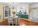 Inviting dining area featuring a vintage hutch and a table set for four, flowing into an updated kitchen at 2413 Racquet Club Dr, Seabrook Island, SC 29455