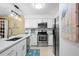 Updated kitchen boasts stainless steel appliances, white cabinets, and modern fixtures for a clean aesthetic at 2413 Racquet Club Dr, Seabrook Island, SC 29455