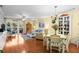 Bright living room with hardwood floors, dining area, comfortable seating, and access to balcony at 2413 Racquet Club Dr, Seabrook Island, SC 29455