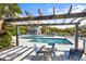 Community outdoor pool area with a pergola and lots of seating at 2413 Racquet Club Dr, Seabrook Island, SC 29455