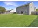 Expansive backyard with lush green grass and a privacy fence at 243 Donatella Dr, Goose Creek, SC 29445