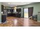Modern kitchen with stainless steel appliances, dark cabinets, and a sliding glass door to the yard at 243 Donatella Dr, Goose Creek, SC 29445