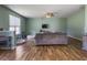 Open-concept living room featuring hardwood floors, neutral paint, and a ceiling fan at 243 Donatella Dr, Goose Creek, SC 29445