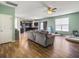 Bright living room with hardwood floors, ceiling fan, and open access to the kitchen at 243 Donatella Dr, Goose Creek, SC 29445